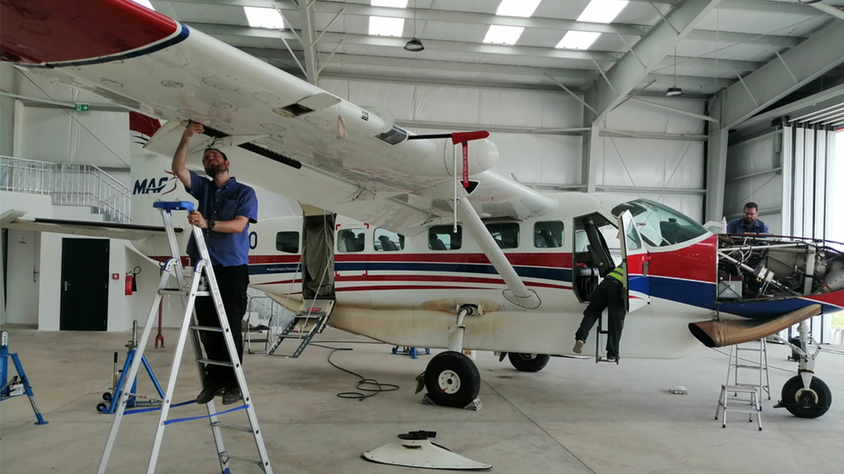 MAF engineer Dave Waterman works on MAF plane out of new hangar in Monrovia, Liberia