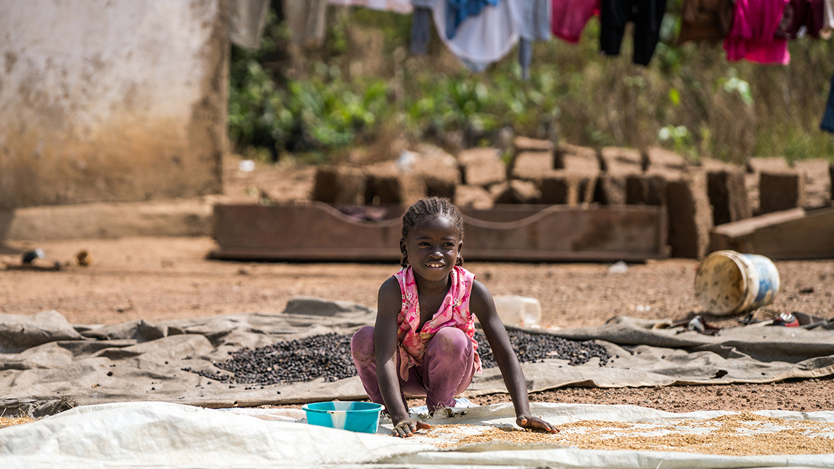 Liberia is one of the poorest countries in the world – girl playing on the ground in Foya