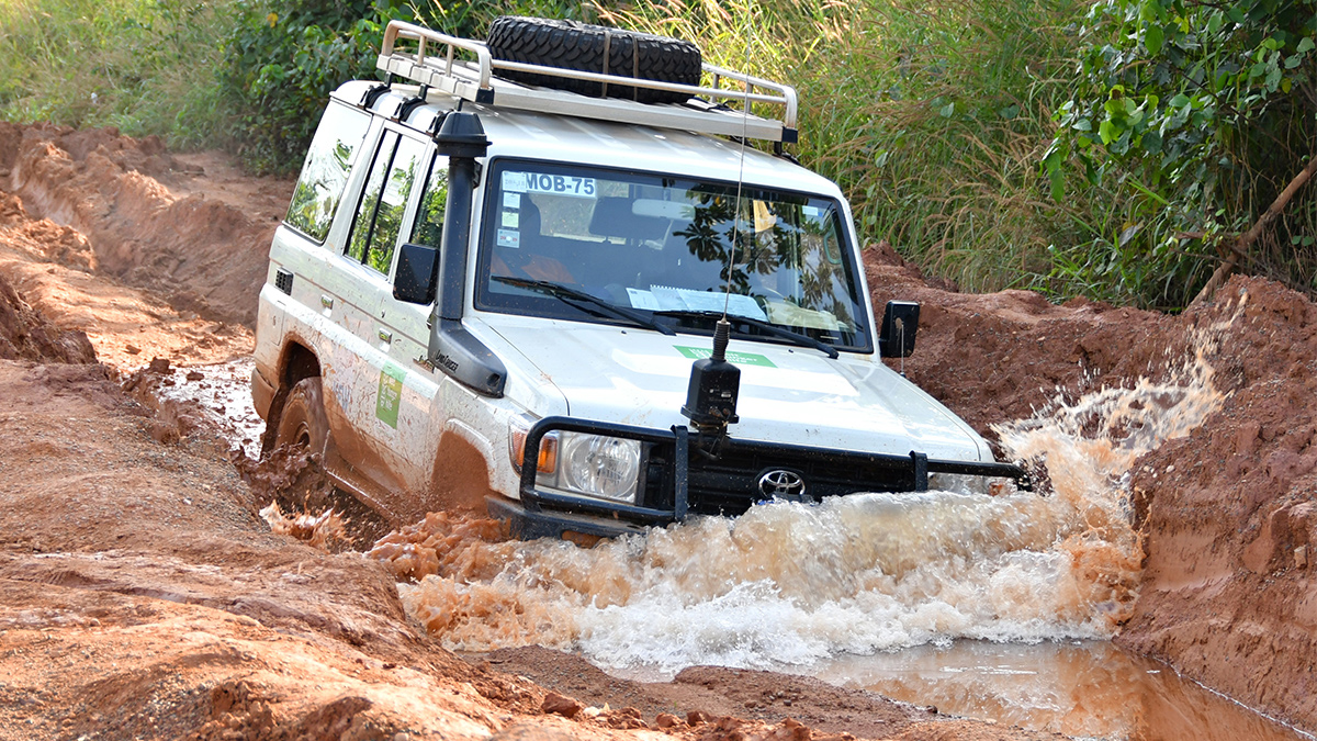 During Liberia’s rainy season, vehicles have to navigate through ditches of dirty water