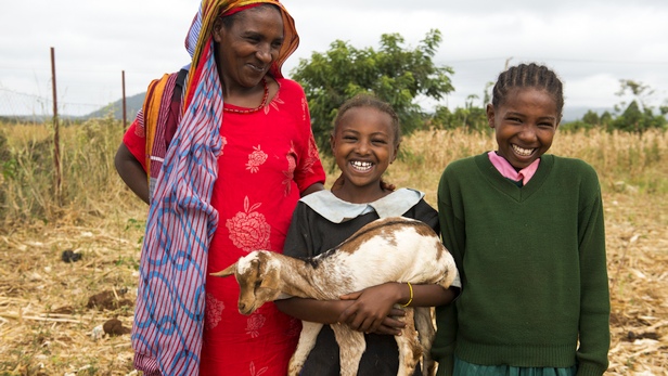 Sube, a Borana widow with her daughter, prepares to give her goat offspring to a Rendille widow as part of the Sauti Moja peace project. Photo: LuAnne Cadd