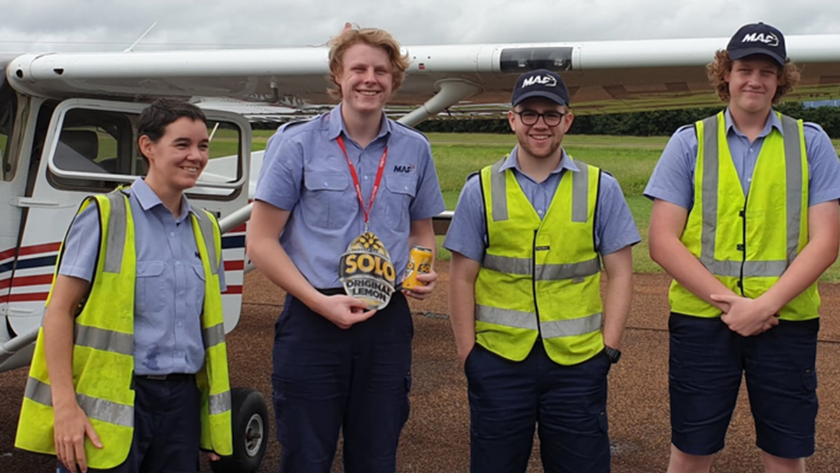 Flight Instructor, Bridget Ingham (far left) in Cooktown with students Jacob, Joe and Nathan (L to R) for a training exercise