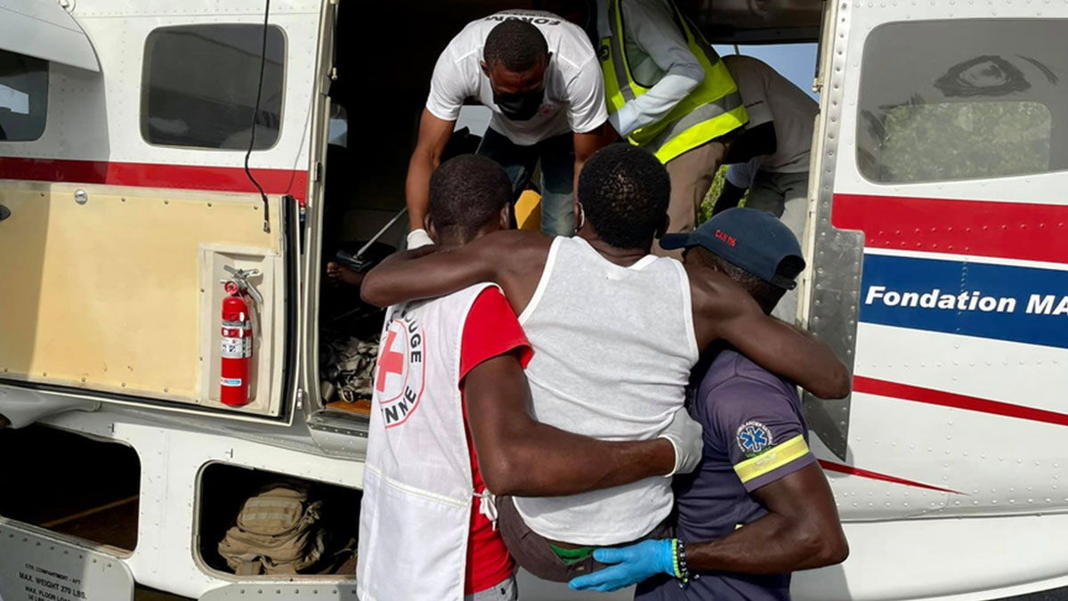 An injured man is medevacked to Port-au-Prince nine days after the earthquake