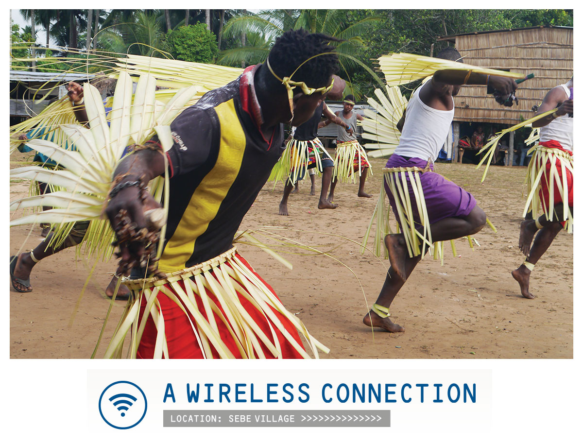 Picture of tribal dance with caption "A wireless connection - location: Sebe village