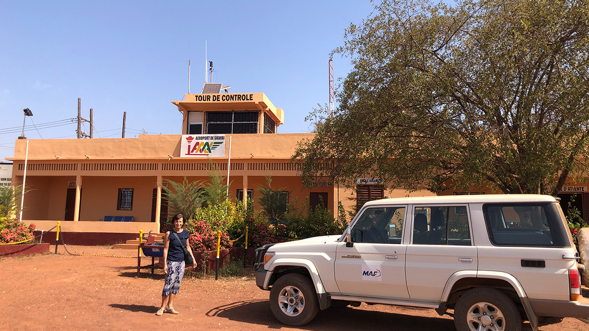 MAF Finance Manager, Margrit Kundig, in front of Siguiri Airport in western Guinea