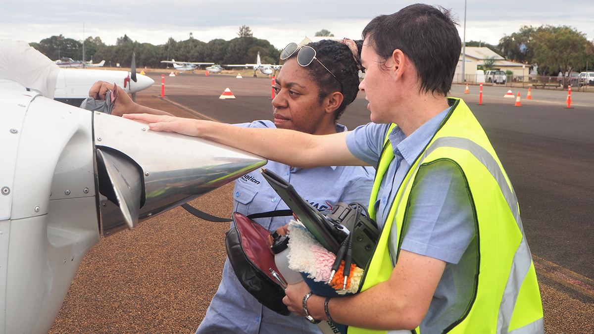 Gloria Kukyuwa – under the watchful eye of Bridget – was the first MAF Mareeba Flight Training Centre  graduate from PNG to complete her Commercial Pilot License in 2019