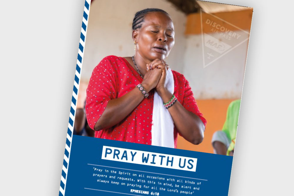 Lady praying with caption "Pray with us"