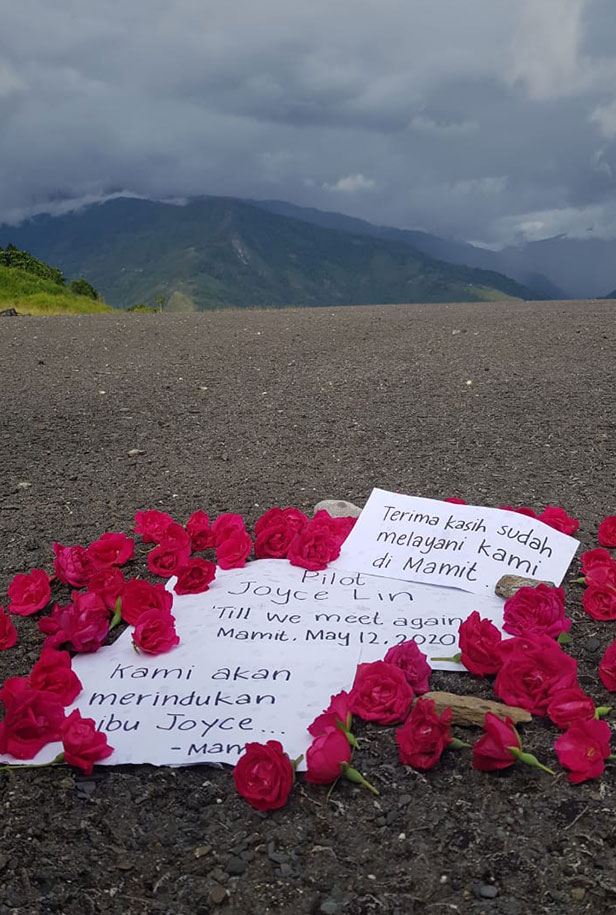 A memorial of roses on the runway of Mamit Village, Papua marks the spot where Joyce was scheduled to land