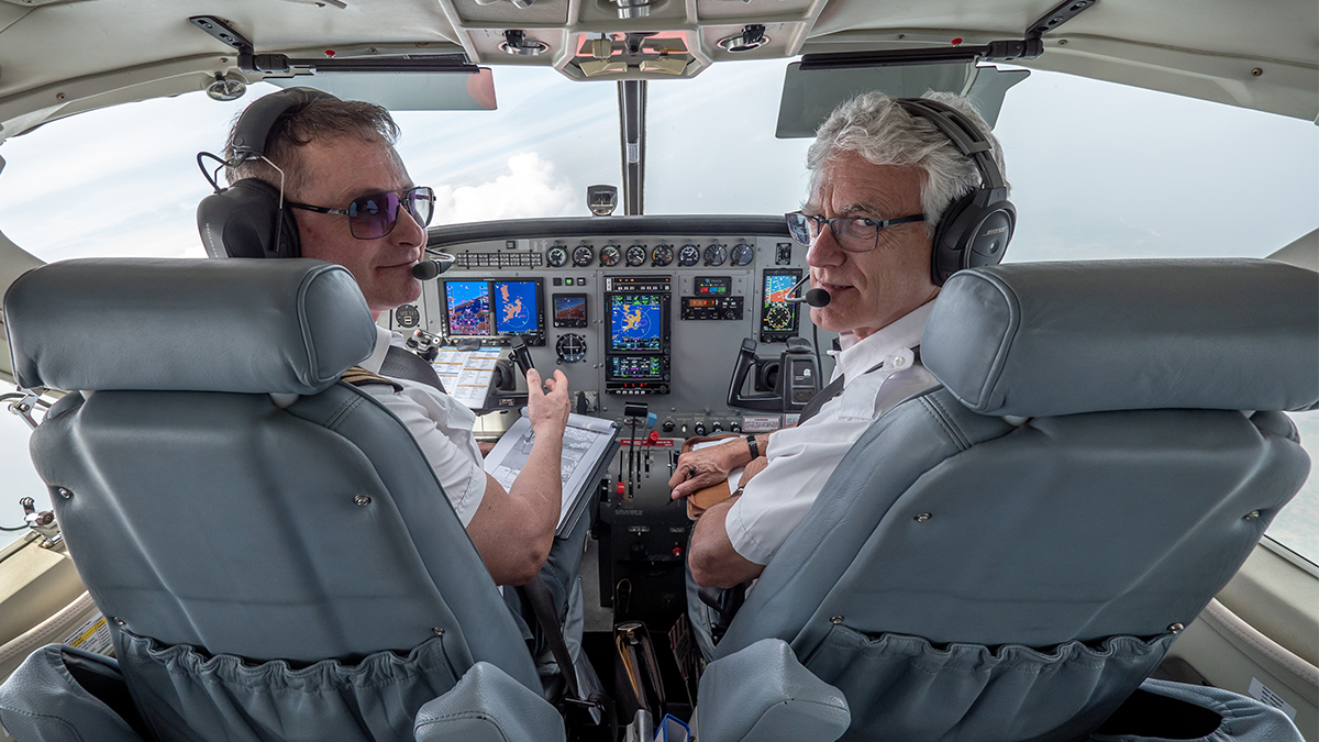 MAF US’ chief pilot Brian Shepson (R) facilitates special training for Roy (L) to meet US registration requirements