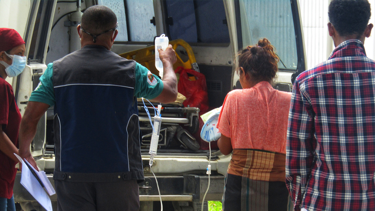 On landing, the 2-year-old boy is transferred to hospital accompanied by his mother and father Broslin dos Santos (R)