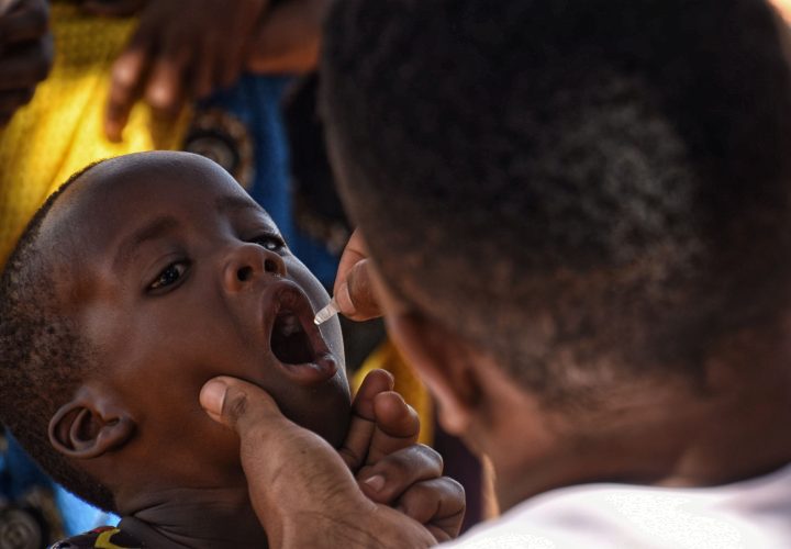 Child receives oral polio vaccine