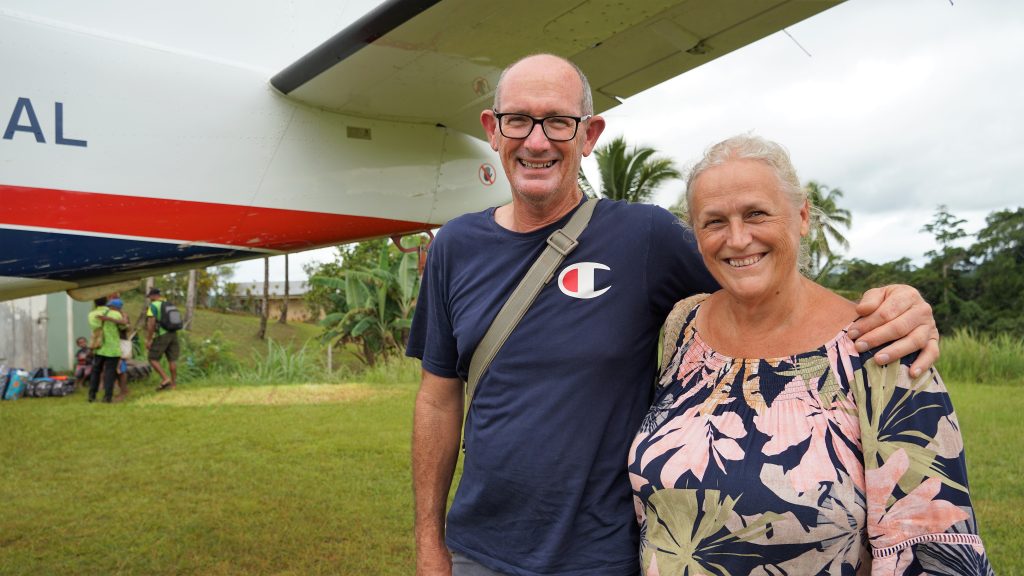 Sally and Ian Lloyd in front of MAF plane who set up the school 