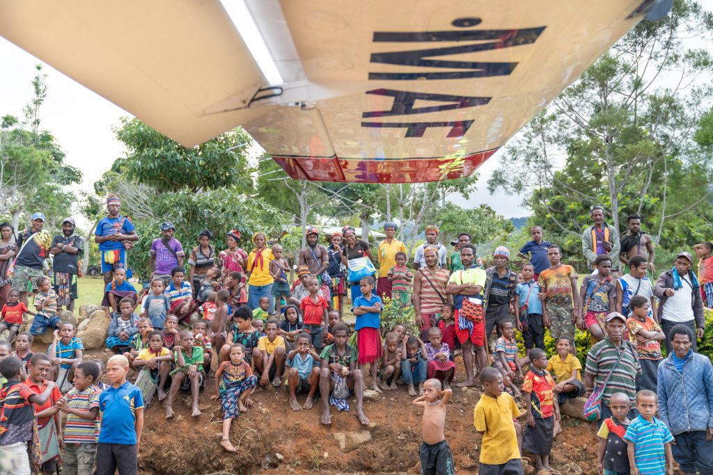 The people of Pyarulama gather round MAF’s plane (credit: Landen Kelly)