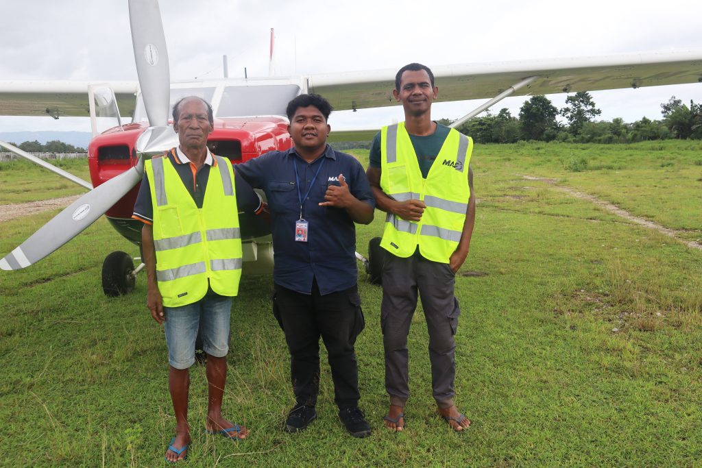 Graciano Tamele – MAF Timor-Leste Ops & Flight Assistant (centre) wouldn’t be able to do his job without local ground agents at Maliana Airstrip (credit: Lobitos Alves)