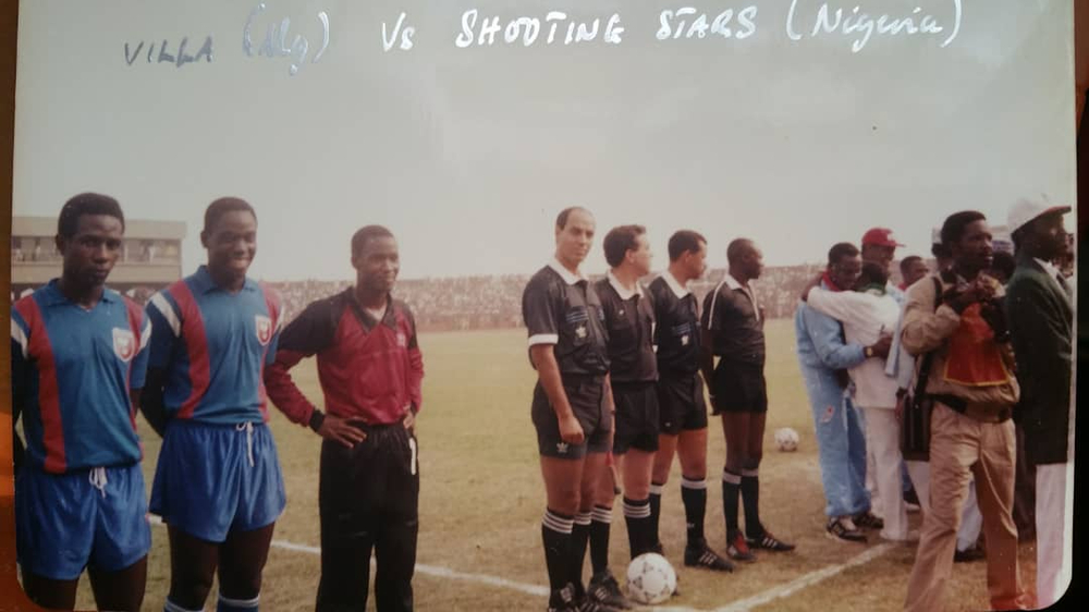 Michael (red top) & his ‘SC Villa’ team play against Nigerian side ‘Shooting Stars’ (credit: Michael Mukasa)