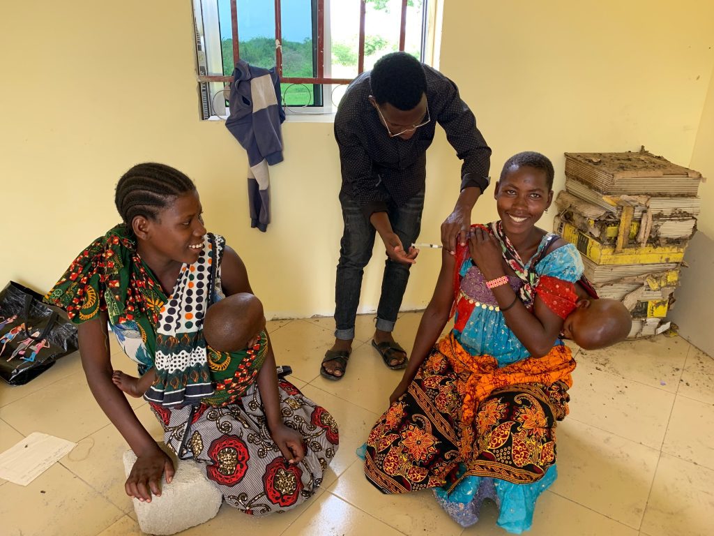 Kilimatinde Hospital Medical Outreach - a women receives a vaccine (credit: Jarkko Korhonen)