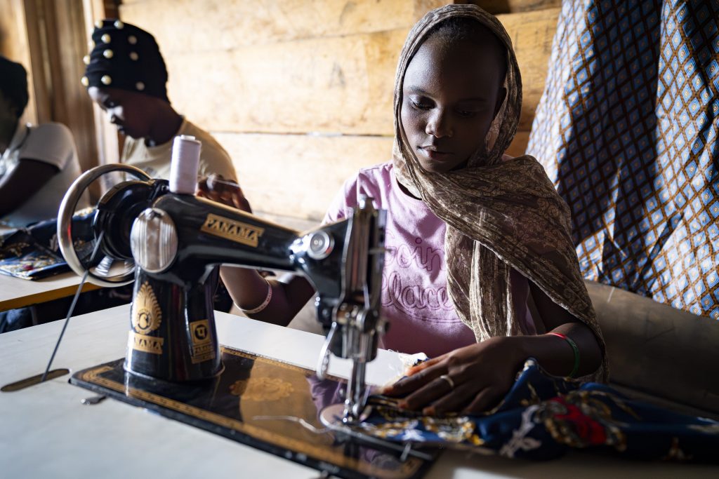 A student benefits from a dressmaking course funded by MAF (credit: Lem Malabuyo)