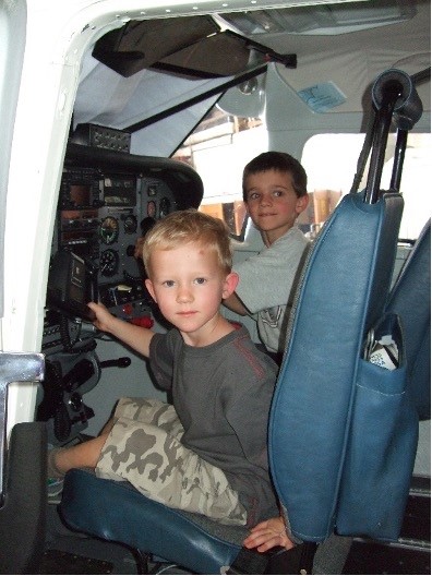 James aged 8 (back) and brother Ben (front) in a Cessna 206 aircraft in Kenya (credit: James Gullett)