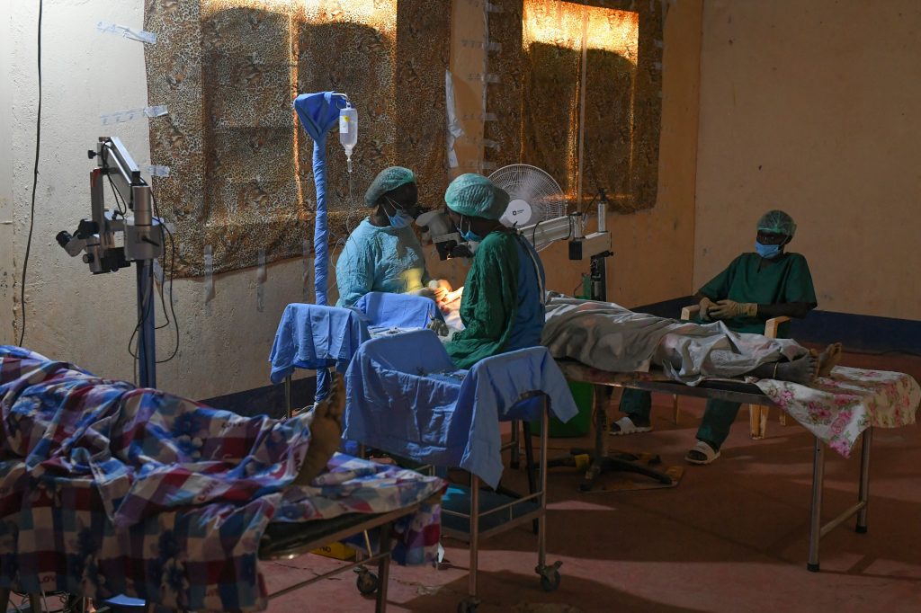 Surgeries in Loolim Village are carried out in an empty hall with makeshift blinds (credit: Jenny Davies)